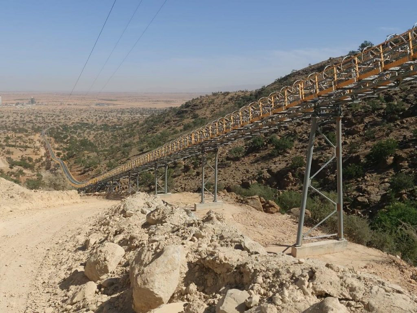 The conveyor is built on a mountain side to connect a quarry and cement plant