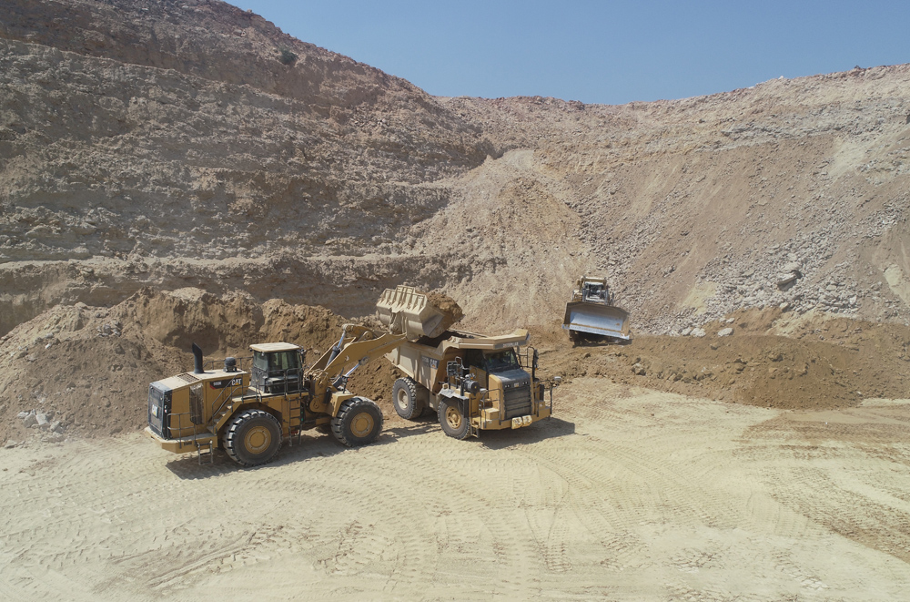 New Cat models at work: a Cat 988K wheeled loader, Cat 772G rigid hauler and Cat D10T2 crawler dozer helping Latomia Latouros process calcareous limestone 