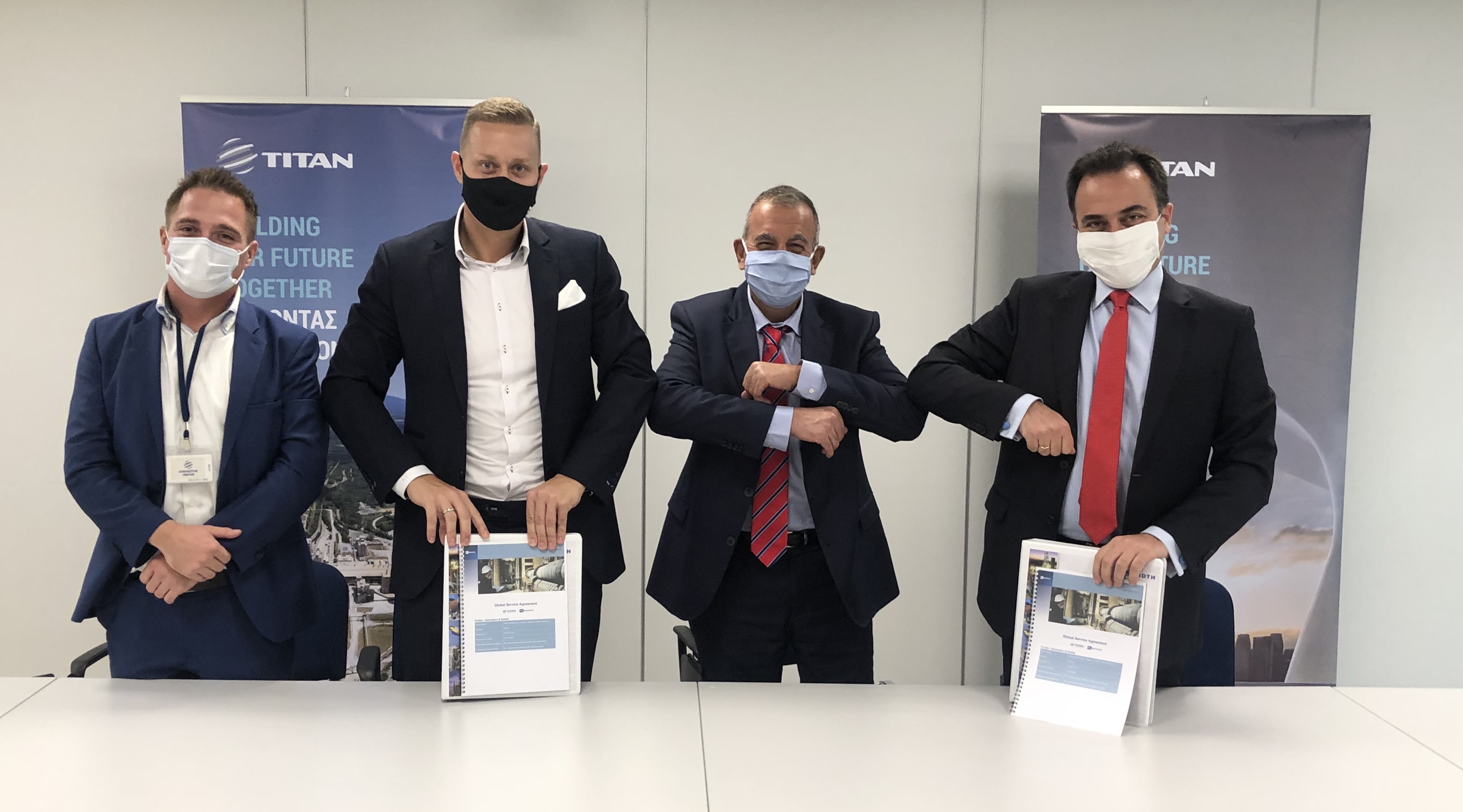 The signing ceremony for the new agreement between FLSmidth and Titan Cement Group. Left to right: Jacob Brinch-Nielsen, head of service execution, FLSmidth; Nicklas Lionett, former head of sales, FLSmidth; Vasileios Giannopoulos, group procurement project director, Titan Cement Group; Antonis Kyrkos, group transformation and strategic planning director, Titan Cement Group