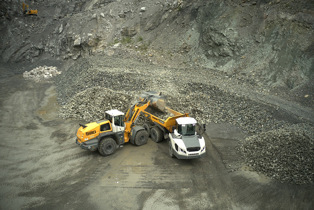 A Liebherr L 580 wheeled loader loading a Liebherr TA 230 ADT at a British quarry