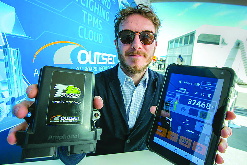 Outset's Luca Toneatti with the company’s new T1 weighing device for vehicle payloads