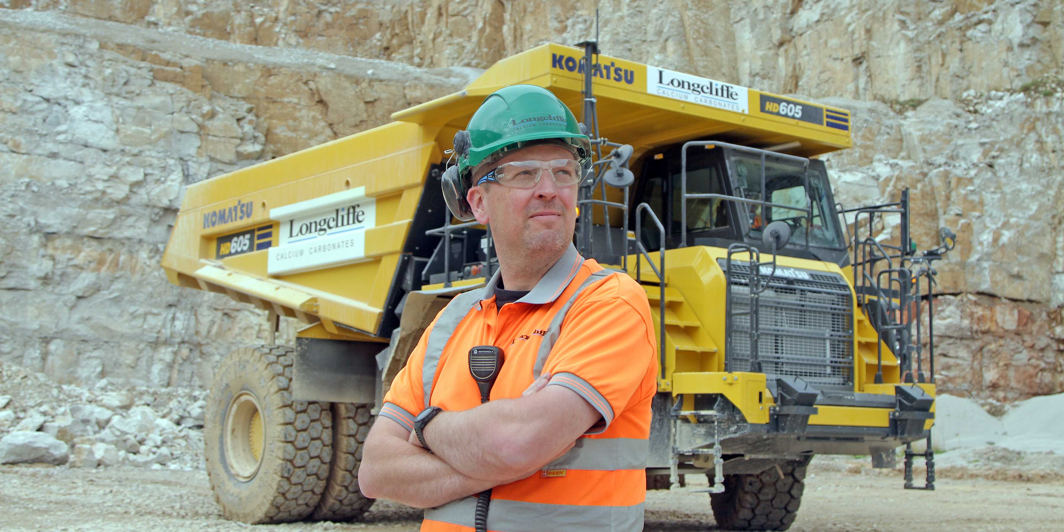 Longcliffe’s Brassington Moor quarry manager Jon Murgatroyd with the new Komatsu dumper. Image: Longcliffe Quarries