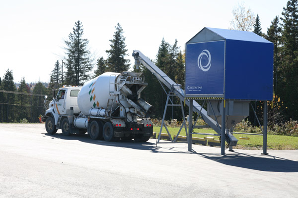 Mixer truck dispensing at plant