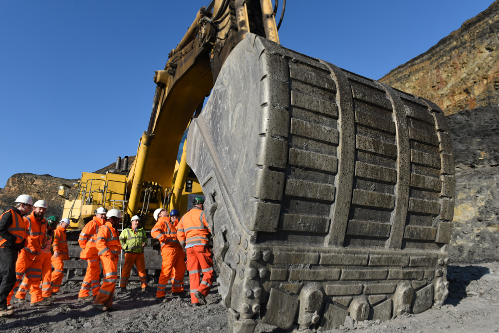 Julian Smallshaw (blue hard hat, second in from the right) on an IQ / University of Derby C4MP study tour in the East Pit of Celtic Energy in Tairgwaith, Ammanford, South Wales. The tour focused on overburden removal in an opencast coal site