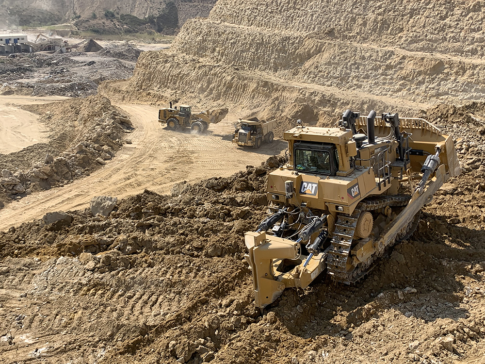 A new Cat D10T2 crawler dozer ripper-excavates calcareous limestone at Latomia Latouros’s Dali quarry