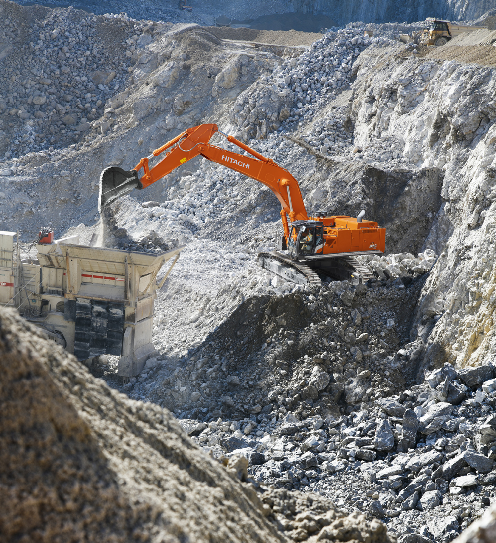 A new Hitachi ZX890LCH-7 crawler excavator feeding a primary crusher