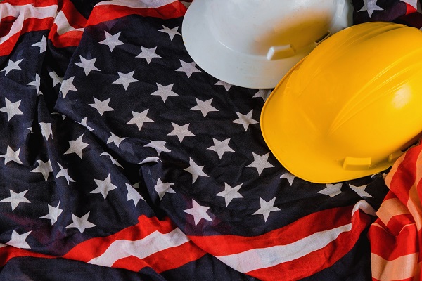 Construction hard hats on an America flag. Pic: Photovs - Dreamstime.com