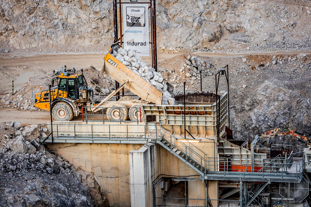 A Bell B30E loading material into a jaw crusher at Bell Equipment and induard and voestalpine’s autonomous site Pic: indurad/voestalpine