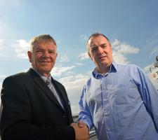 Gary Bell and Kieran Hegarty shake hands on the agreement