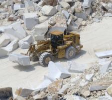 Caterpillar 988H transports a marble block