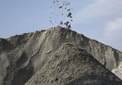 A manufactured sand stockpile at an Asian aggregates materials processing site.jpg