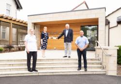  Tillicoultry Quarries director Wallace Menzies (second from right) presents a cheque covering the cost of renovations to Irene McKie (second from left), chief executive of the Strathcarron Hospice charity