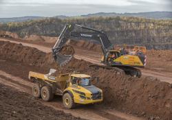 A Chepstow Plant International Volvo EC750E excavator and Volvo A40G articulated haul truck carrying out quarrying work