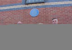 Representatives from Tarmac and Nottinghamshire County Council at Trent Bridge cricket ground with the blue plaque for Edgar Hooley