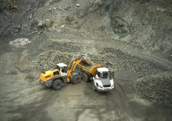 A Liebherr L 580 wheeled loader loading a Liebherr TA 230 ADT at a British quarry