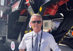 Erwin Schneller, SBM Mineral Processing managing director, in front of the JAWMAX 400 jaw crusher