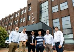 Left to right: Andy Regan, Antony Beamish, Karim Massaad (all of GRS), former premier league footballer Jody Morris, Gary Coles (GRS), Jon Fisher (GRS chief executive), pictured outside the new office