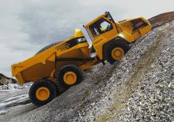 Doosan truck driving up stone hill