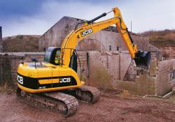 JCB excavator demolishing a building