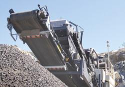 crusher by pile of aggregates