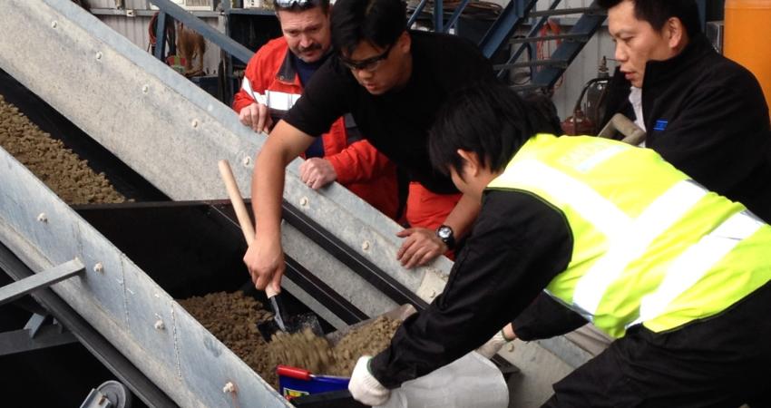 Sand material being collected by employees of Chung Kang Aggregate Enterprise