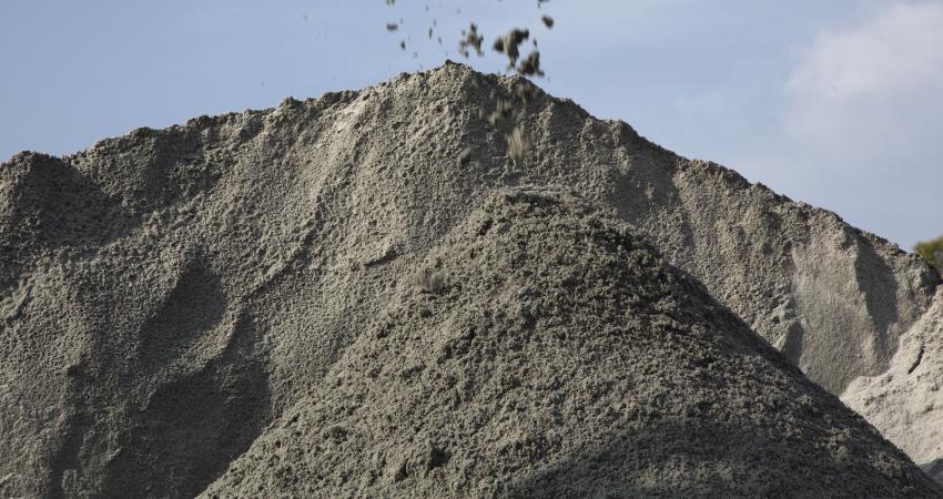 A manufactured sand stockpile at an Asian aggregates materials processing site.jpg