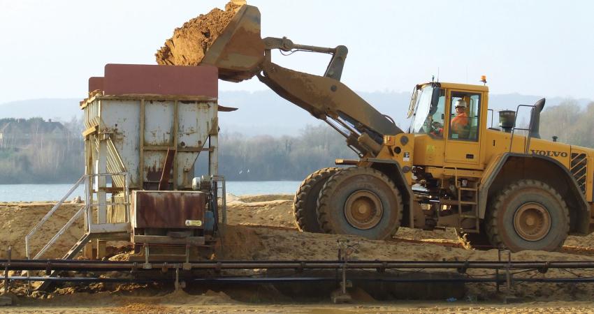 loader depositing sand