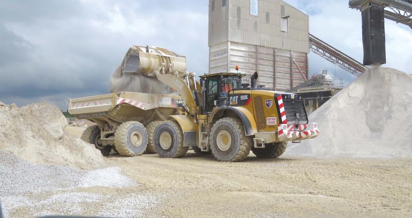 Caterpillar 980K wheeled loader with Cat 740B ADT