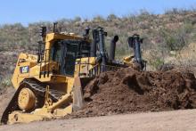 A Cat D11T large dozer working via remote control.jpg