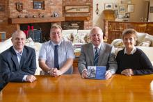 Norman Grundon (holding book) at the launch of The Road from Sand & Gravel.jpg