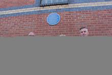 Representatives from Tarmac and Nottinghamshire County Council at Trent Bridge cricket ground with the blue plaque for Edgar Hooley