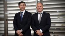 Outgoing Yanmar Energy System president Tetsuya Yamamoto with his successor Peter Aarsen (right)