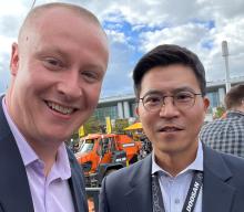 Doosan Infracore Europe CEO Chris Jeong with Aggregates Business editor Guy Woodford at bauma 2022 in Munich, Germany