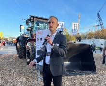 Hitachi Construction Machinery Europe’s Bill Drougkas at bauma with the new ZW250-7 wheeled loader. Image: Guy Woodford