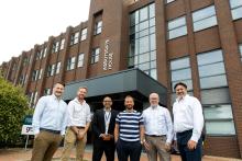 Left to right: Andy Regan, Antony Beamish, Karim Massaad (all of GRS), former premier league footballer Jody Morris, Gary Coles (GRS), Jon Fisher (GRS chief executive), pictured outside the new office