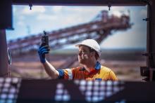 A Weba Chute Systems manager assessing dust at a transfer point. Dust control solutions improve safety and minimise environmental impact. Pic: Weba Chute Systems