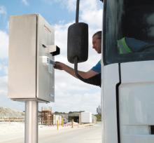 man using weighbridge console