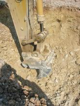 Excavator mounted ripper attachment