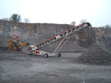 Mobile conveyor in use on quarry site 