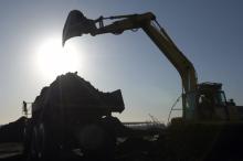 Excavator moving soil