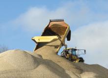 ADT truck emptying gravel at quarry