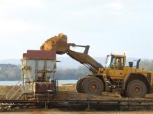 loader depositing sand