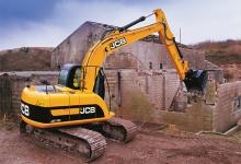 JCB excavator demolishing a building