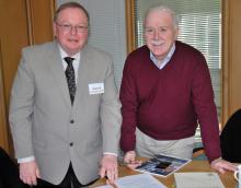 TEC founder and president, Cameron Thomas (left) and MDL’s Steve Ball sign the acquisition deal at MDL’s York headquarters, England