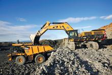 Cat 775G truck being loaded by the Cat 390D hydraulic excavator