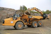 A Breedon Cat 740B being loaded by a Cat 336E hybrid